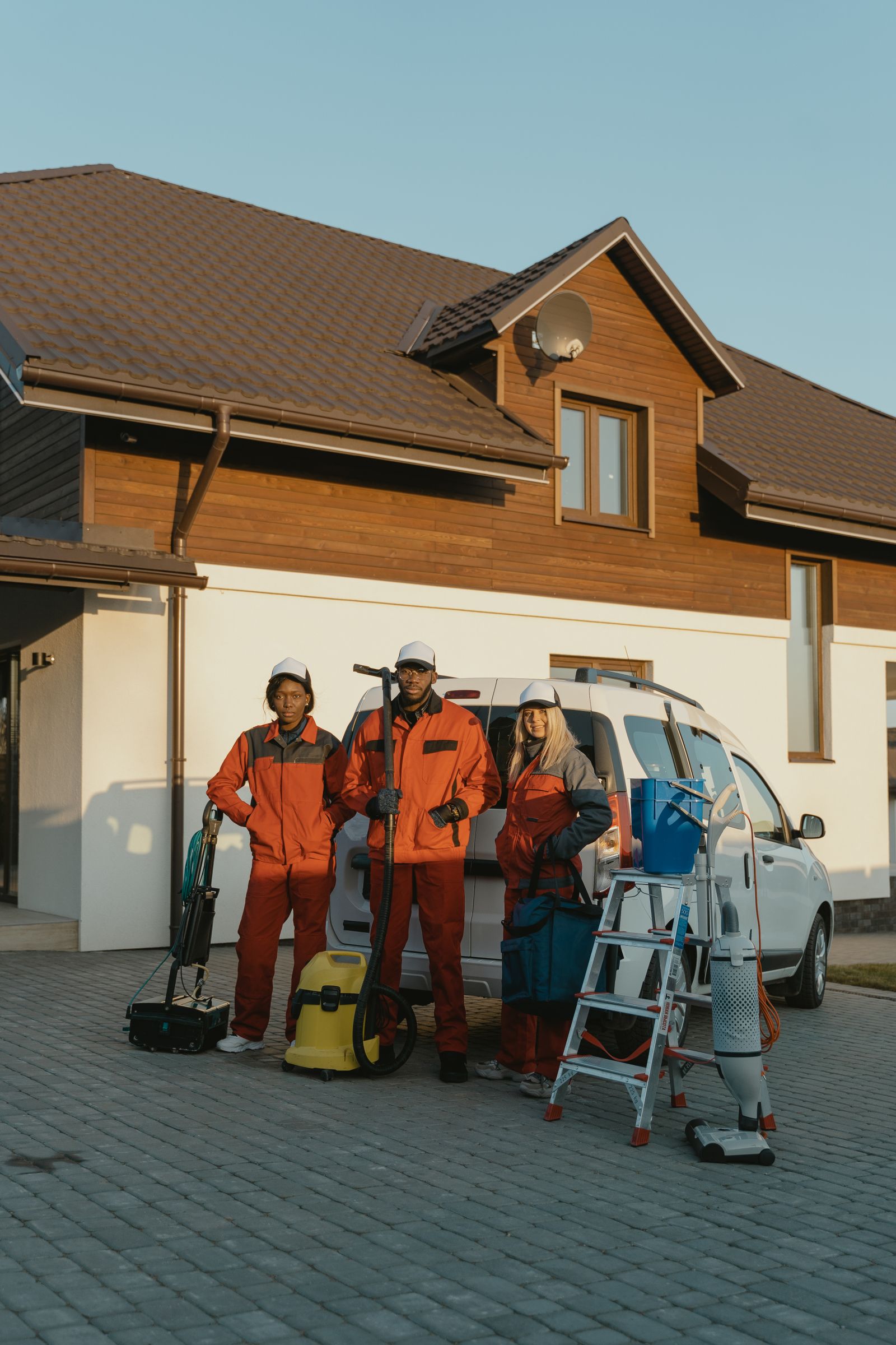Crossroads Restoration technicians with cleanup equipment outside a home
